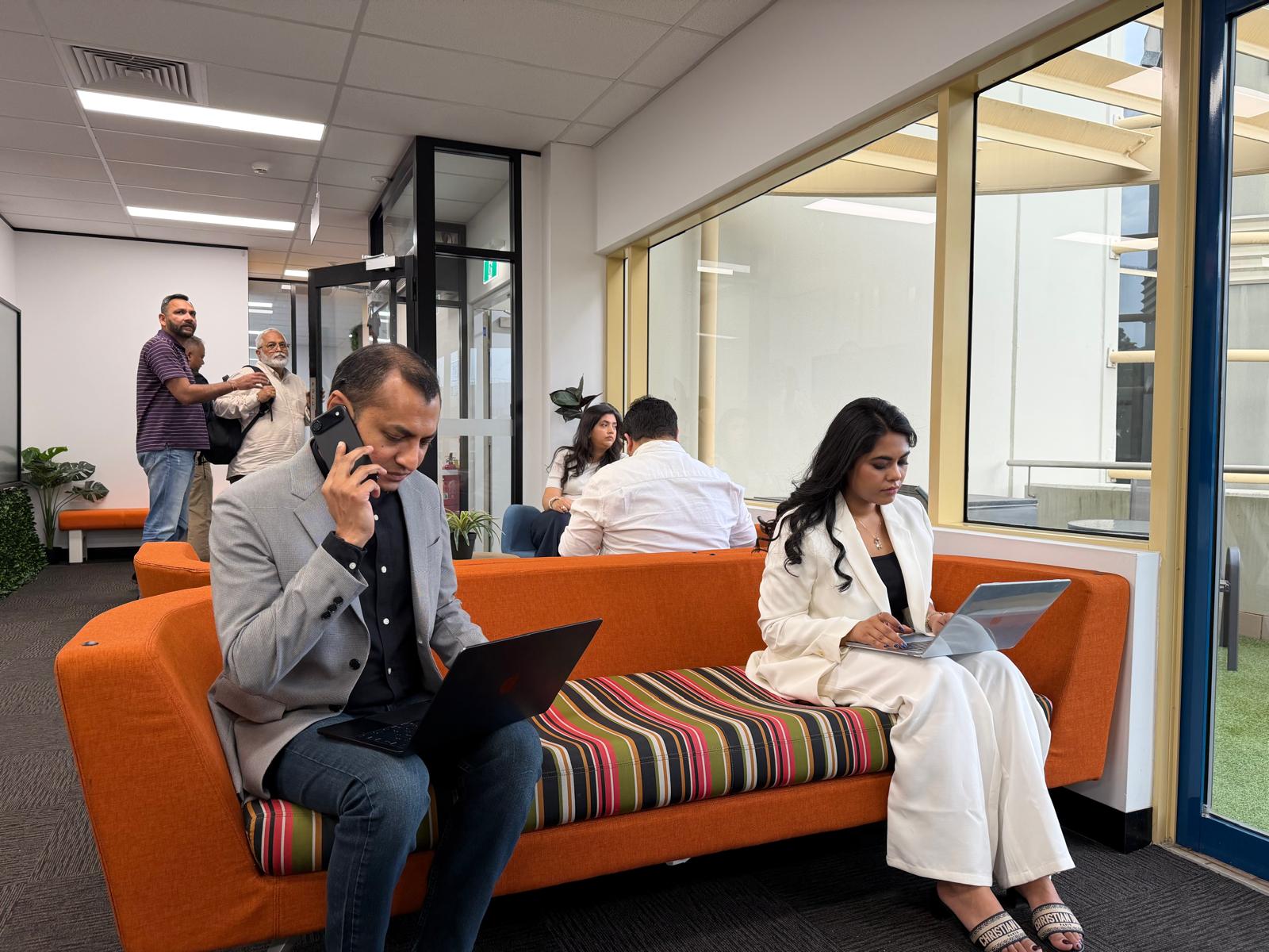 Colleagues working together in an informal office space